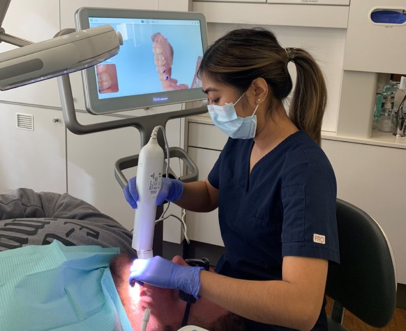 man smiling in dentists chair