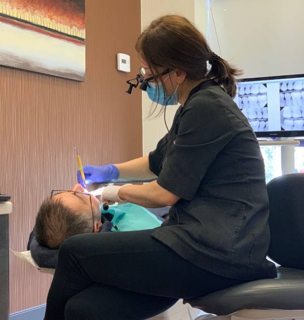 man smiling in dentists chair